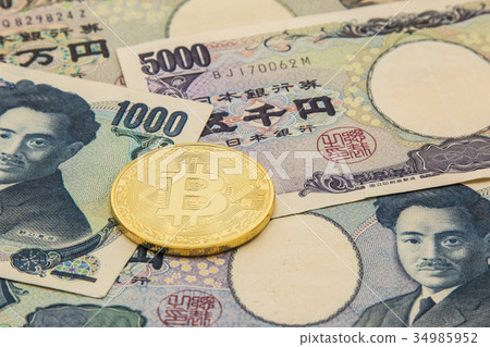 bitcoin on pile of many type japan banknotes 34985952