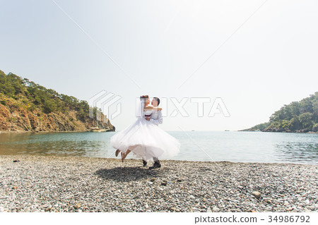 honeymoon couple travel sea and beach resort in 34986792