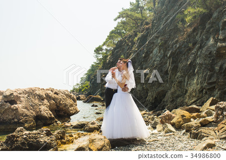 Just married couple embraced 34986800