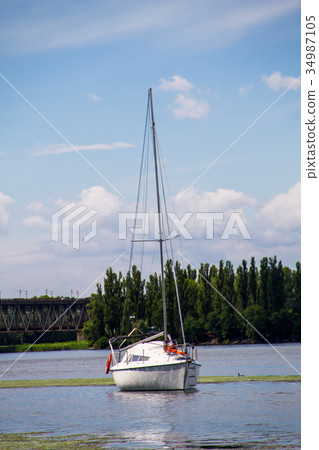 White sailing yacht on the river Dnieper White sailing yacht on the river Dnieper 34987105