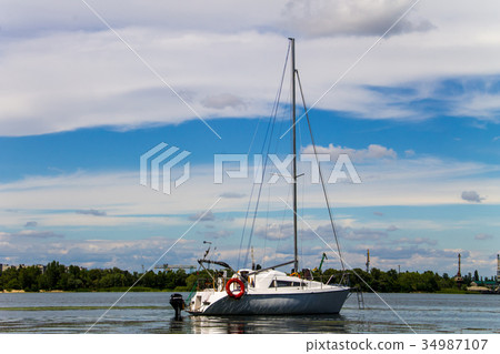 White sailing yacht on the river Dnieper White sailing yacht on the river Dnieper 34987107