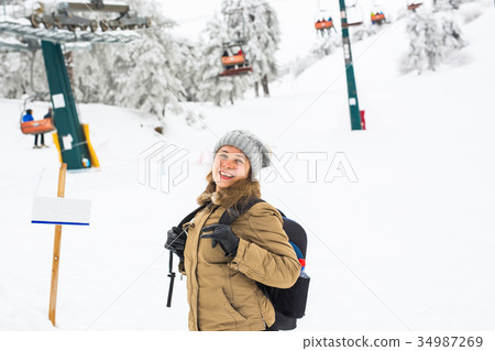 Woman winter hiking. Beautiful young caucasian Woman winter hiking. Beautiful young caucasian 34987269