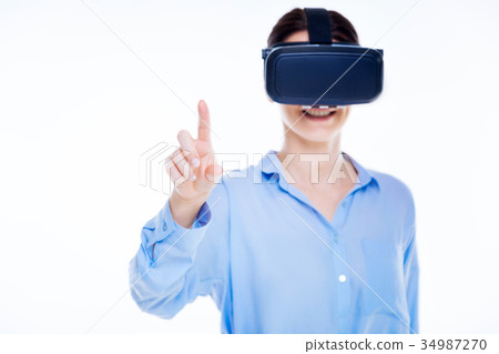 Happy delighted woman using virtual technologies Happy delighted woman using virtual technologies 34987270