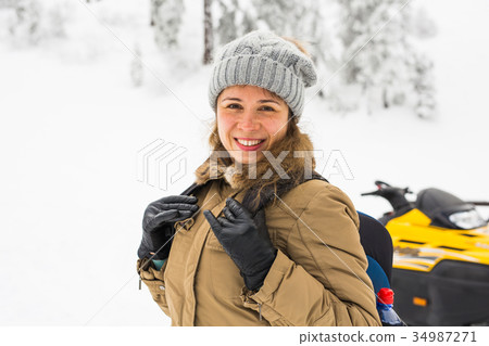 Happy girl on winter nature background. Winter 34987271