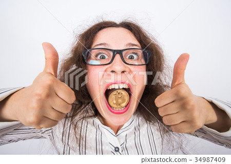 Surprised funny business woman showing Golden Surprised funny business woman showing Golden 34987409