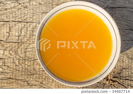 Sweet honey in bowl on rustic wooden table Sweet honey in bowl on rustic wooden table 34987714
