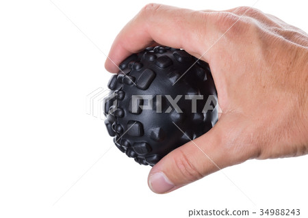 Hand holding a ball with spikes for myofascial 34988243
