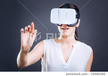 Happy nice woman using virtual panel 34988360