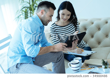 Pleasant successful people watching something on Pleasant successful people watching something on 34988486