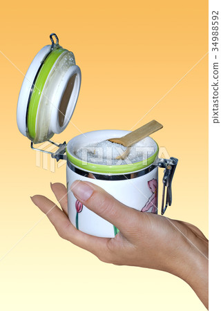 sugar bowl on hand with path sugar bowl on hand with path 34988592