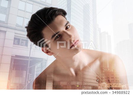 Calm teenager looking at you with mysterious 34988922