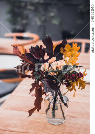 Autumn bouquet in a glass vase 34991840