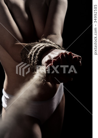 woman tied hands woman tied hands 34992585