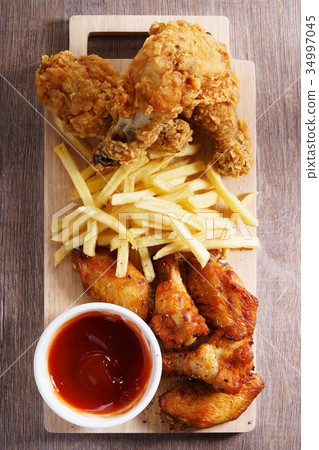 fried chicken legs. 34997045