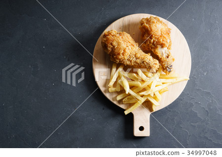 fried chicken legs. 34997048