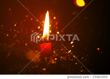 Burning candle flame Burning candle flame 35001059