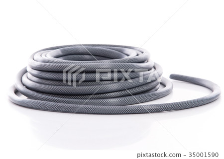 curled garden hose isolated on white 35001590