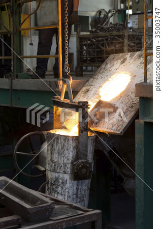 Molten iron molten metal poured in to ladle 35003747