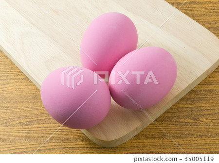 Three Pink Century Egg on Cutting Board 35005119