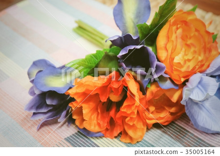 Orange Artificial Ranunculus with Blue Flowers Orange Artificial Ranunculus with Blue Flowers 35005164