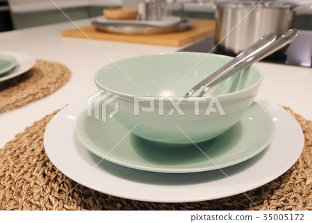 Set of Porcelain Plates, Bowls and Silverware 35005172