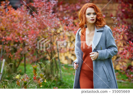 Outdoors portrait of colorful clothed gorgeous fall fashion girl 35005669
