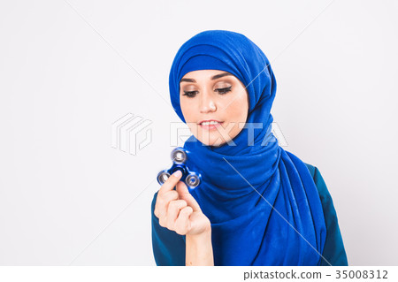 Young beautiful muslim girl holding and playing 35008312