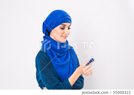 Young beautiful muslim girl holding and playing 35008322