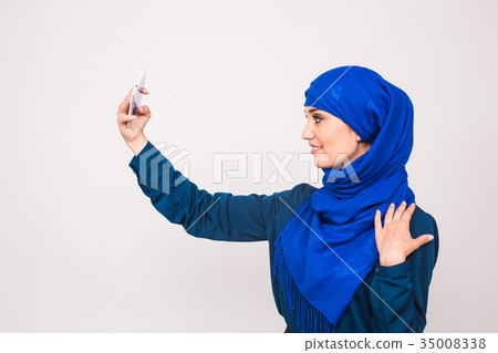 Portrait of beautiful muslim young woman wearing Portrait of beautiful muslim young woman wearing 35008338