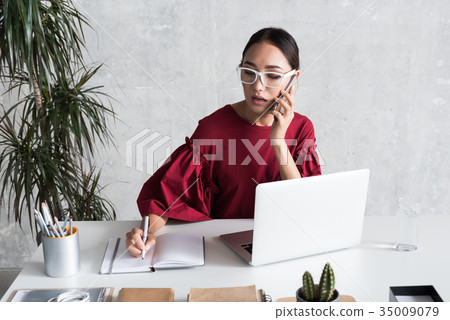 Confident stylish girl is having business Confident stylish girl is having business 35009079