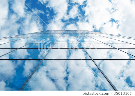 modern business high rise glass building and blue 35013165