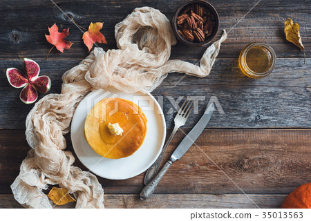 Pancakes with butter, honey and nuts 35013563