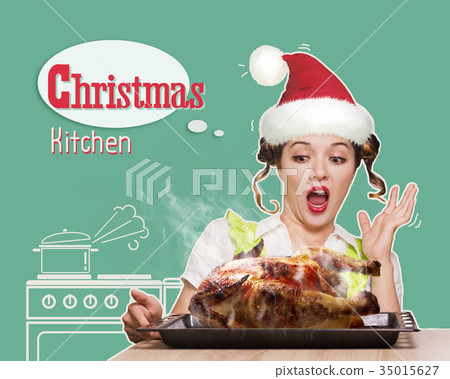 Christmas kitchen.Young woman overlooked roast chicken in her ki Christmas kitchen.Young woman overlooked roast chicken in her ki 35015627
