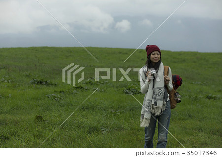 Woman traveling alone trekking Woman traveling alone trekking 35017346