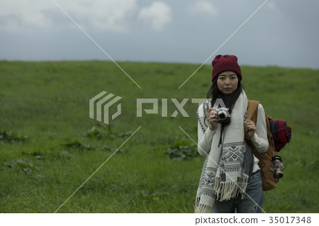 Woman traveling alone trekking Woman traveling alone trekking 35017348