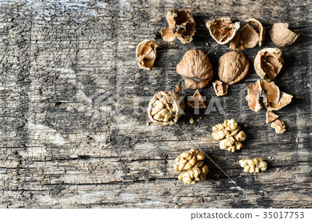 Delicious nuts on an old wooden table, copyspace 35017753