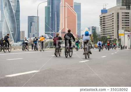 Mass bicycle ride in city. Youth, families Mass bicycle ride in city. Youth, families 35018092