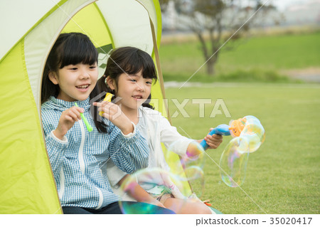 Children elementary school girl camping outdoors image 35020417