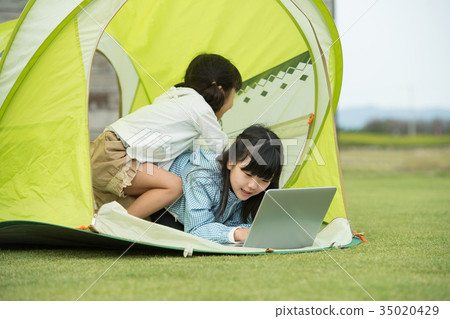 Children elementary school girl camping outdoors image 35020429