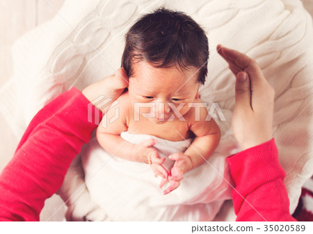 Baby boy being cared for by his mother Baby boy being cared for by his mother 35020589