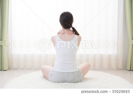 Woman doing self massage, neck, shoulder Woman doing self massage, neck, shoulder 35020683