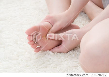 Woman doing self massage, soles of feet, feet 35020717
