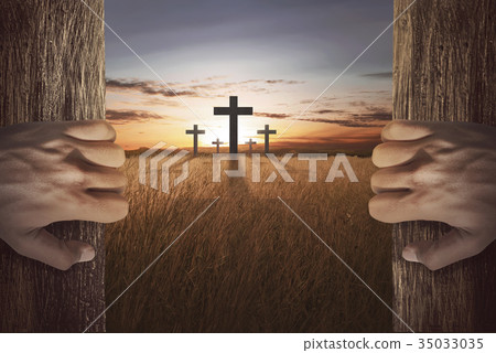 Human hand opening wooden door and looking cross 35033035