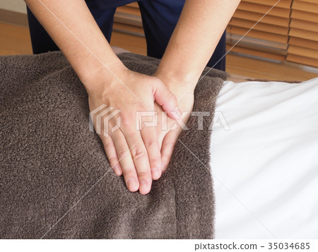 Man's hand doing stomach massage 35034685