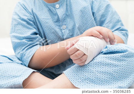 kid with broken hand and elastic bandage kid with broken hand and elastic bandage 35036285