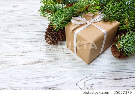 Christmas gift box on the white wooden background Christmas gift box on the white wooden background 35037379
