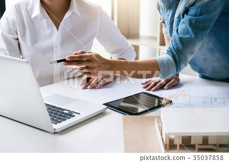 Two young women interior design or graphic designer working on p Two young women interior design or graphic designer working on p 35037858