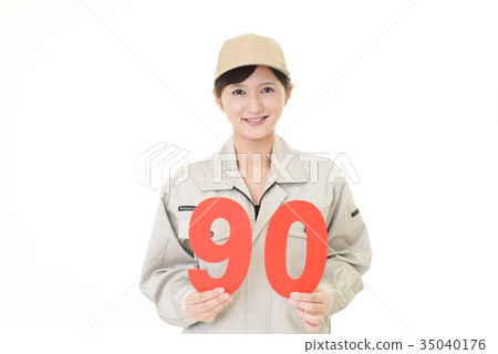 Female worker with numbers Female worker with numbers 35040176