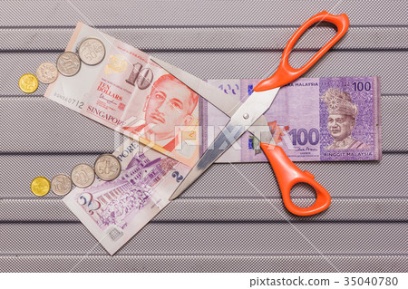 Singapore dollar and Coins on top of Ringgit 35040780