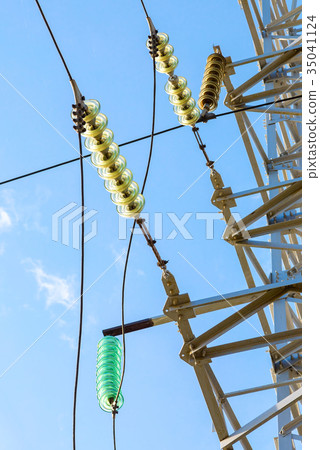 High voltage electric tower against the blue sky High voltage electric tower against the blue sky 35041124